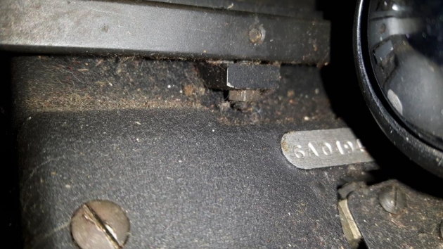 The serial number is on the left upper frame under the platen knob.